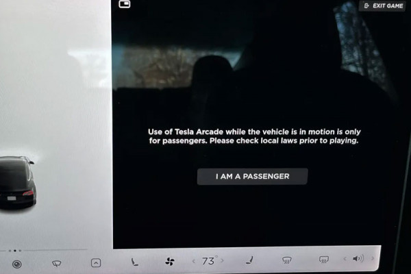 Tesla will stop letting people play games in cars that are moving